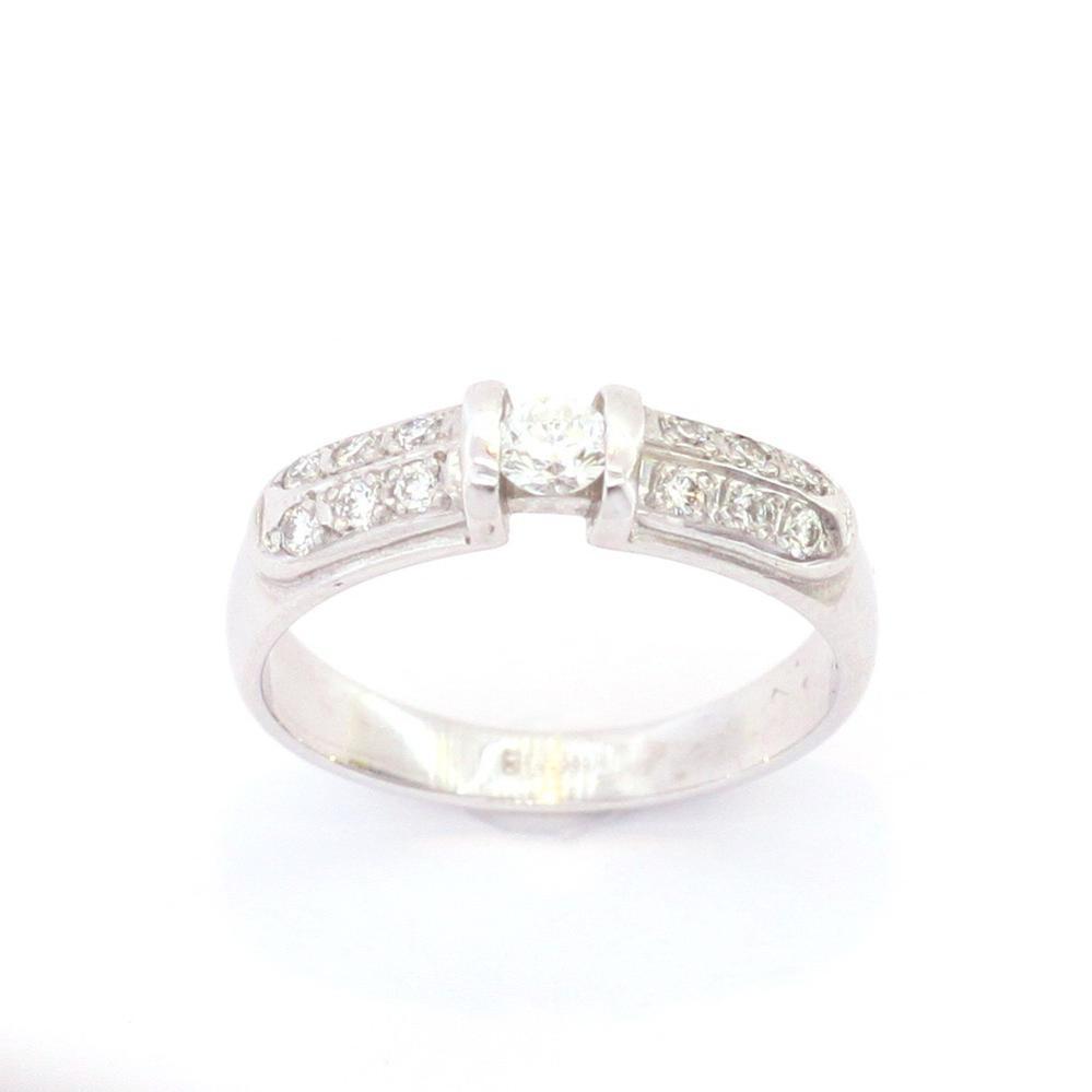 Золота каблучка з діамантами в білому золоті 585 проби