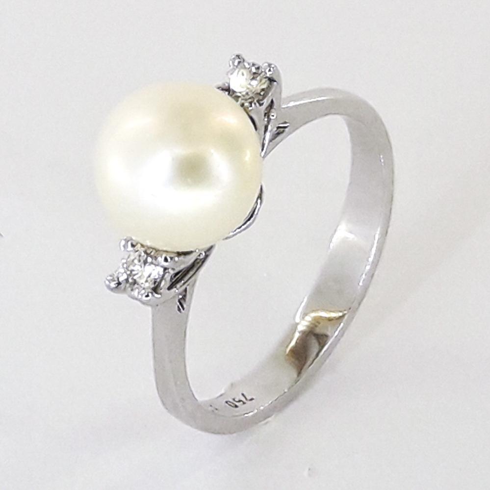 Золота каблучка з білого золота з діамантами і перлами