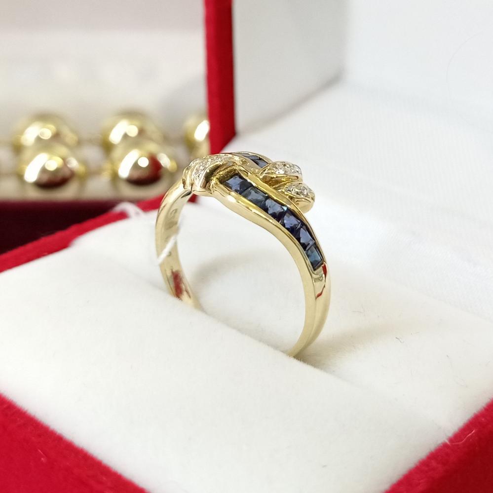 Золота каблучка з сапфірами та діамантами