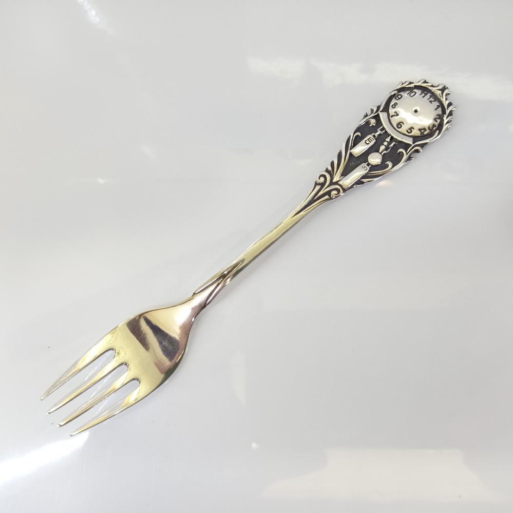 Дитяча срібна виделка Годинник
